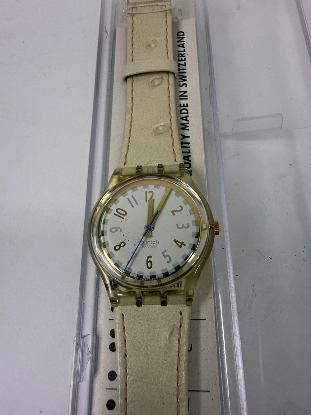 Swatch Cream Strap Analog Watch with Blue Second Hand